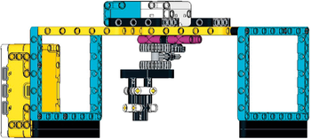 LEGO Technic szerkezet fogaskerekekkel és tengelyekkel LEGO Technic szerkezet különböző színű elemekkel, fogaskerekekkel és tengelyekkel.